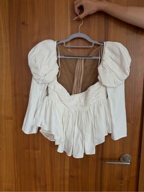 KHAITE Kim top Ivory Puff-Sleeve Peplum Blouse
